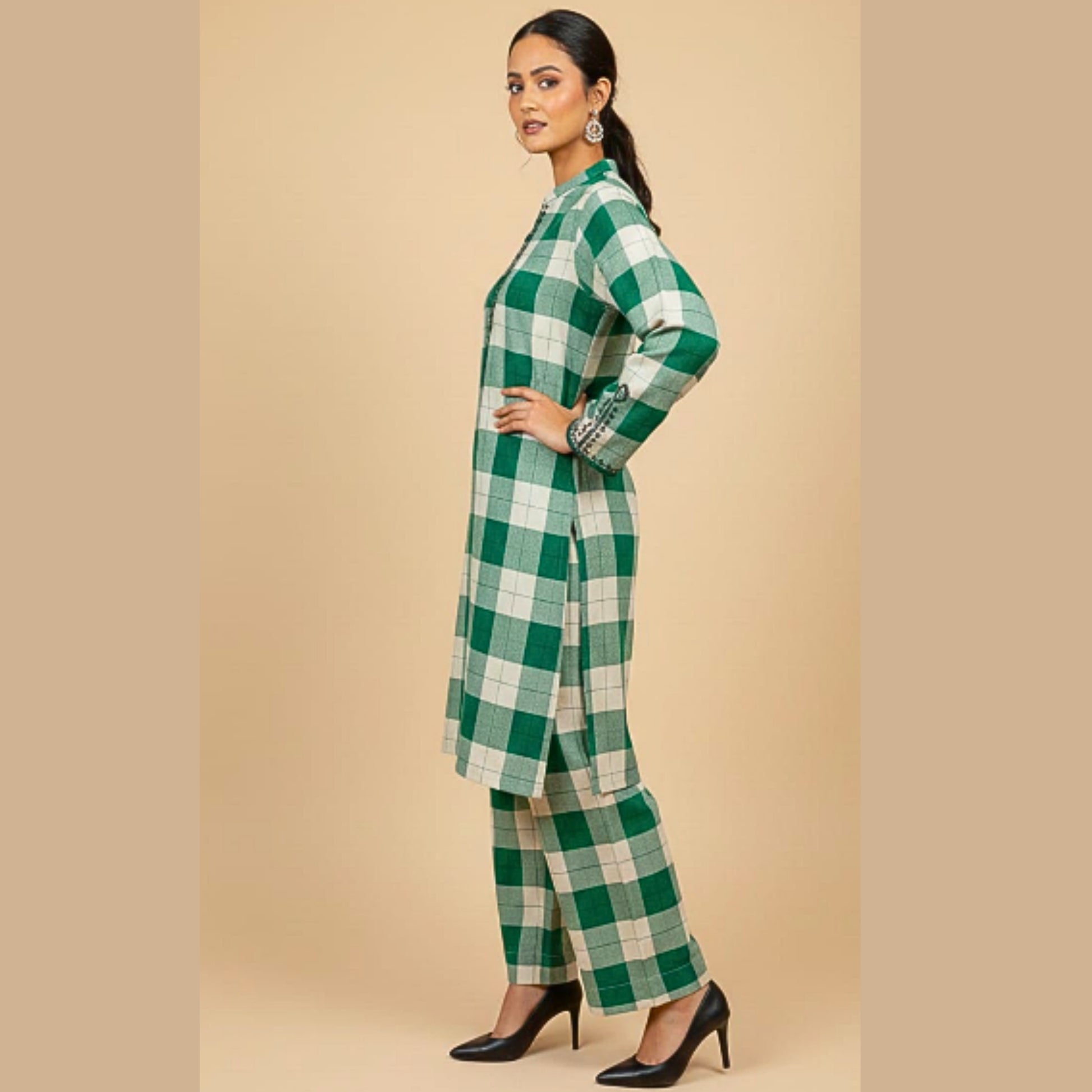 Woman wearing a green and white checkered outfit on a beige background